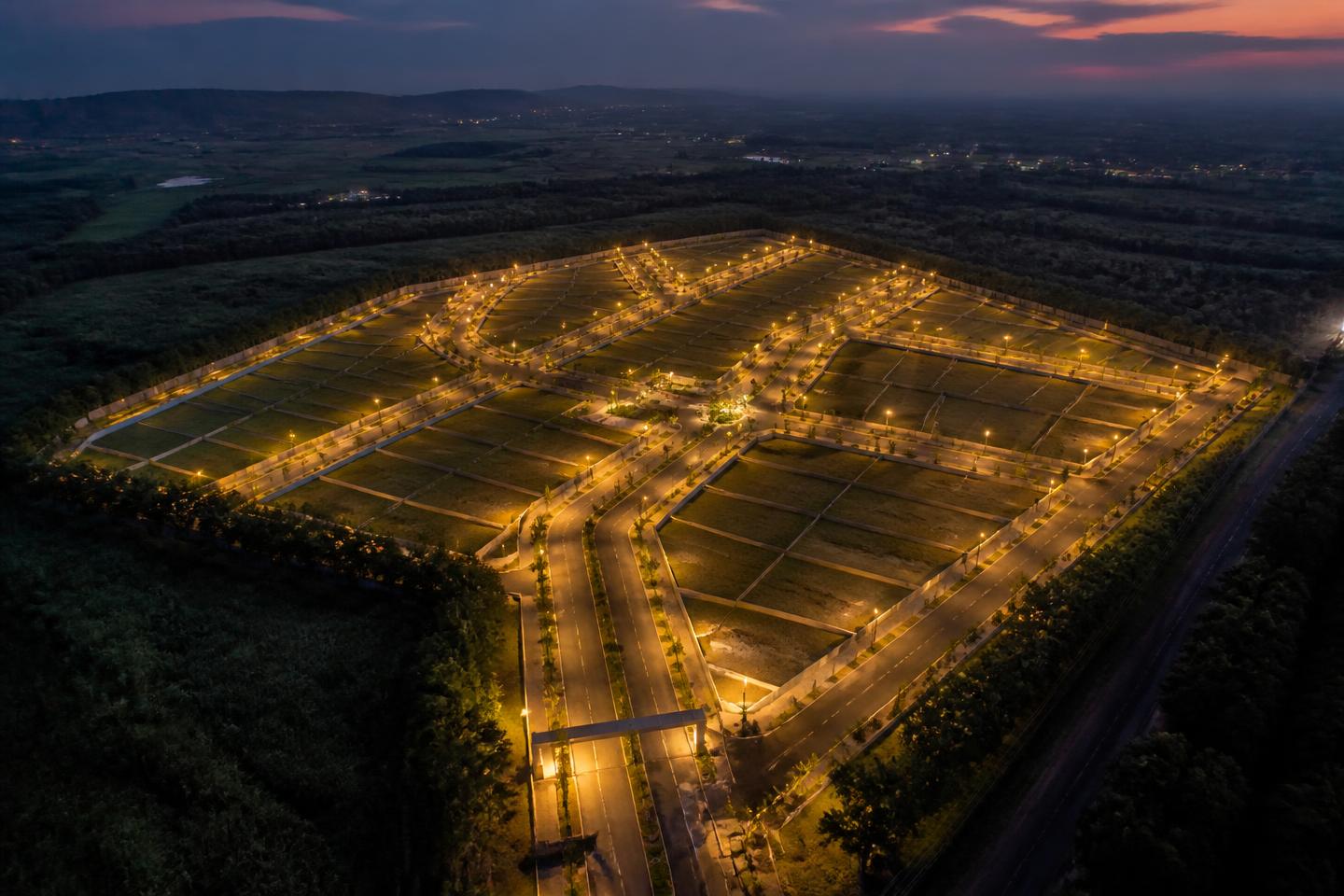 Aerial view of a planned plotted development at dusk